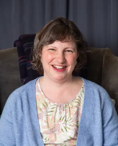 Hester sitting on a chair
